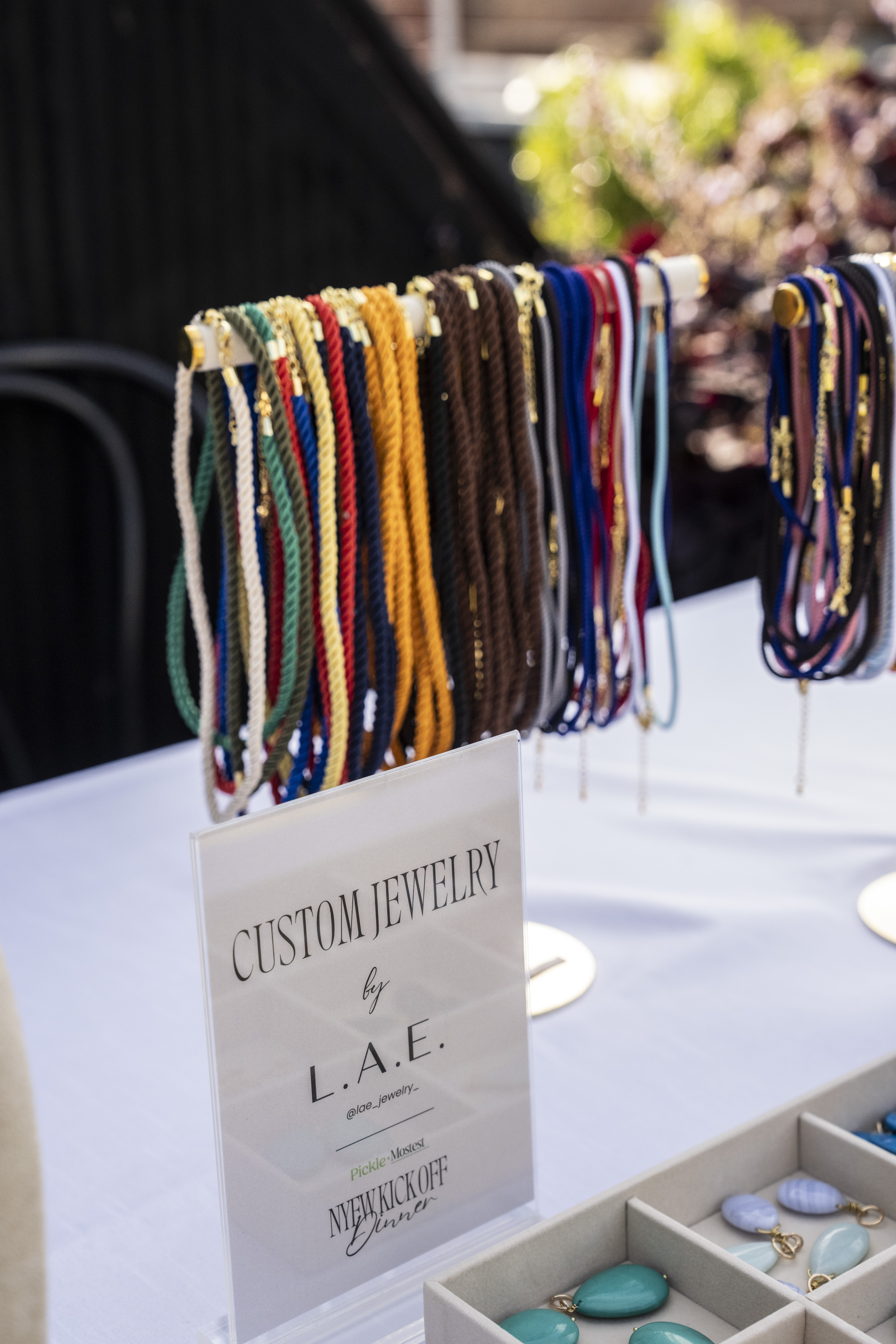 Colorful custom jewelry necklaces displayed at the Mostest Pickle New York Kickoff Dinner.
