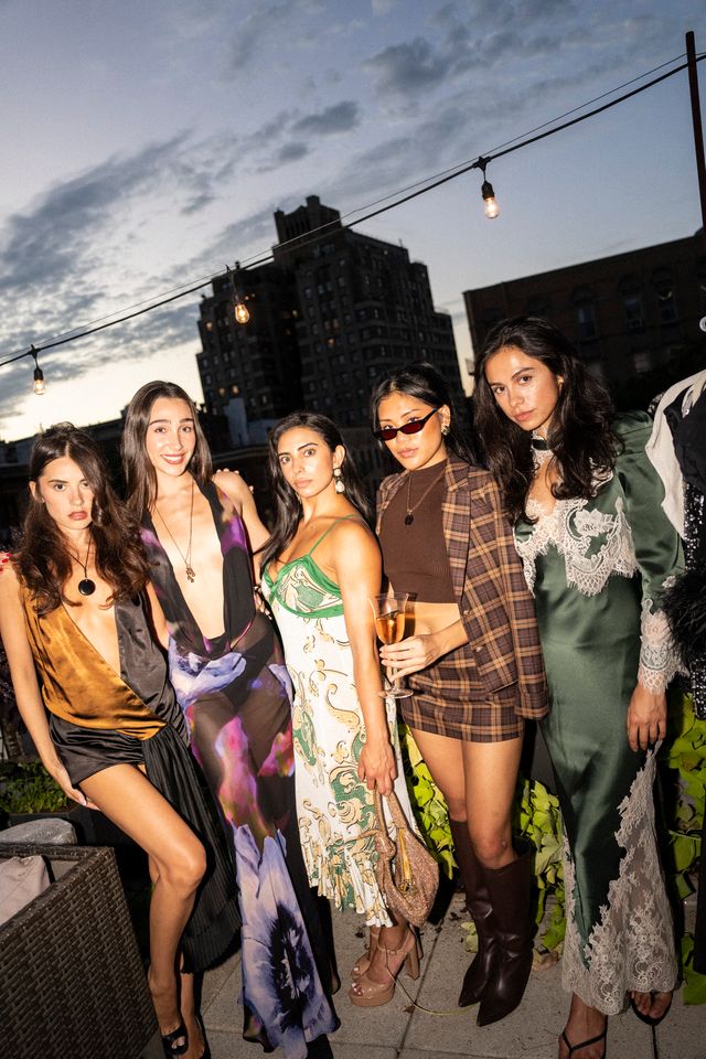 Guests posing together at the Pickle x Mostest New York Kickoff Dinner.